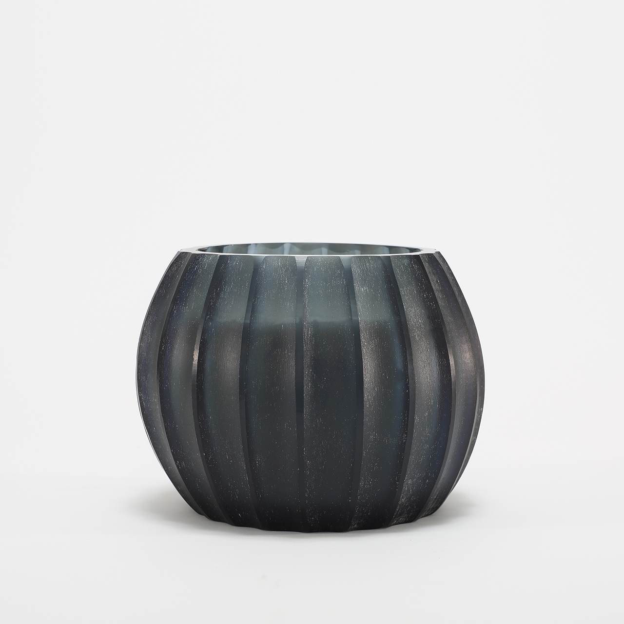 Atolla Blue Bottle Candle burning, releasing Red Santal fragrance in handcrafted blue glass vessel