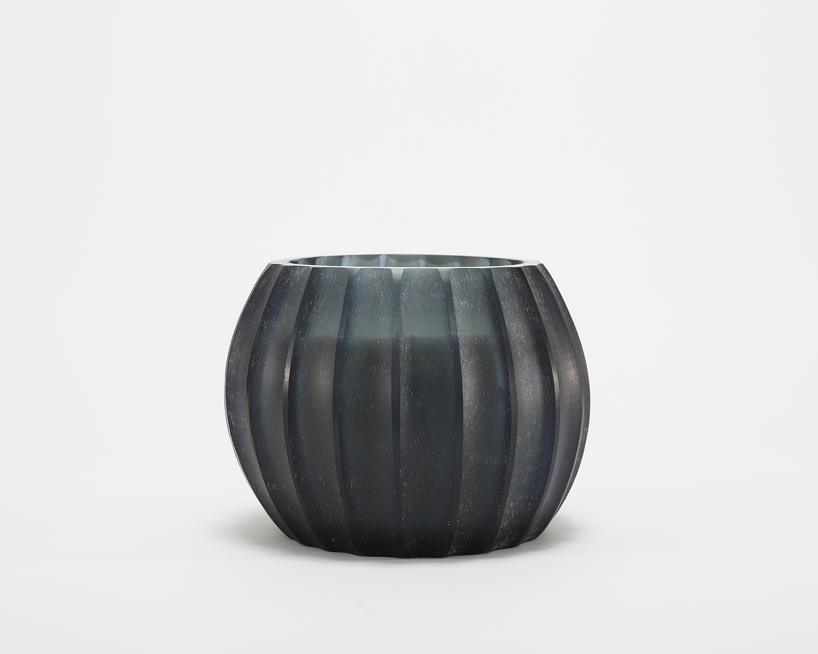 Atolla Blue Bottle Candle burning, releasing Red Santal fragrance in handcrafted blue glass vessel